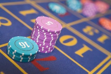 Live dealer at Dream Gaming roulette table in professional studio